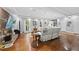 Bright living room features hardwood floors, a fireplace, and access to the staircase at 108 Ridgepath Way, Cary, NC 27511