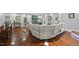 Spacious living room with hardwood floors, brick fireplace, and large sectional sofa at 108 Ridgepath Way, Cary, NC 27511