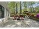 Stone patio with chairs and fire pit, with a gazebo in the background at 108 Ridgepath Way, Cary, NC 27511