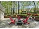 Stone patio featuring fire pit, chairs and a gazebo in the background at 108 Ridgepath Way, Cary, NC 27511