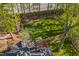 Overhead view displays a well-kept lawn, mature trees, and a brick chimney at 108 Sierra Dr, Chapel Hill, NC 27514