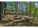 Shaded backyard with a pergola swing and winding stone pathway at 108 Sierra Dr, Chapel Hill, NC 27514