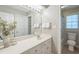 Bright bathroom featuring a white vanity, a large mirror, and a separate toilet room for added privacy at 108 Sierra Dr, Chapel Hill, NC 27514