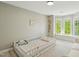 Bright and airy bedroom featuring a toddler bed, large windows, and neutral decor at 108 Sierra Dr, Chapel Hill, NC 27514