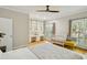 Bright bedroom boasts built-in shelves, a crib, and large windows, creating a cozy and functional space at 108 Sierra Dr, Chapel Hill, NC 27514
