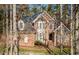 Traditional brick home featuring a gabled roof and inviting front entrance nestled among mature trees at 108 Sierra Dr, Chapel Hill, NC 27514