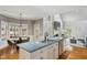 Beautiful kitchen open to the living room and breakfast area featuring a granite island and stainless steel appliances at 108 Sierra Dr, Chapel Hill, NC 27514