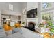 Inviting living room with vaulted ceilings, fireplace, and open concept design to kitchen and breakfast nook at 108 Sierra Dr, Chapel Hill, NC 27514