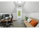 Attic office space with a desk, comfortable seating, and a window providing natural light at 108 Sierra Dr, Chapel Hill, NC 27514