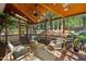 Inviting screened-in porch with comfortable seating and a ceiling fan for relaxing outdoor living at 108 Sierra Dr, Chapel Hill, NC 27514