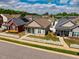 Inviting home featuring a green lawn and a white picket fence, situated in a quiet and well-maintained residential area at 110 Plott Hound Dr, Clayton, NC 27520