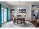 Charming dining room with natural light, stylish decor, and a view into the kitchen area, ideal for gatherings at 110 Plott Hound Dr, Clayton, NC 27520