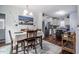 Dining room with beach decor opens to updated kitchen with stainless steel appliances at 110 Plott Hound Dr, Clayton, NC 27520