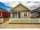 Charming home featuring a well-maintained yard and a cute white picket fence, enhancing its curb appeal at 110 Plott Hound Dr, Clayton, NC 27520