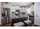 Kitchen features stainless steel appliances, granite countertops, and dark wood flooring at 110 Plott Hound Dr, Clayton, NC 27520