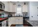 Kitchen features stainless steel appliances and tile backsplash at 110 Plott Hound Dr, Clayton, NC 27520
