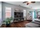 Open-concept living room featuring hardwood floors, natural light, and stylish decor for comfortable living at 110 Plott Hound Dr, Clayton, NC 27520
