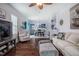 Spacious living room with hardwood floors, neutral colors, and a seamless flow into the dining area and kitchen at 110 Plott Hound Dr, Clayton, NC 27520