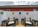 Cozy patio space with charming flower decorations on a white fence, complemented by comfortable seating at 110 Plott Hound Dr, Clayton, NC 27520