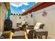 Relaxing patio featuring comfortable wicker furniture, a grill, and a bright umbrella for a perfect outdoor retreat at 110 Plott Hound Dr, Clayton, NC 27520
