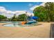 Community pool featuring a splashpad and slide, providing a fun and engaging recreational space at 110 Plott Hound Dr, Clayton, NC 27520