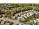 Bird's-eye view of a suburban street showcases neat houses with green lawns and ample parking space at 112 Pink Dogwood Ln, Mebane, NC 27302