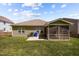 Photo shows the home's outdoor area featuring a screened porch, patio, and verdant lawn at 112 Pink Dogwood Ln, Mebane, NC 27302