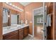 Bathroom features double sinks, tile floors, and walk-in shower access at 112 Pink Dogwood Ln, Mebane, NC 27302