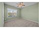 Bedroom with neutral carpet, ceiling fan and exterior view at 112 Pink Dogwood Ln, Mebane, NC 27302
