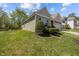 Well-kept lawn and garden with a view of home's siding and trimmed bushes on a sunny day at 112 Pink Dogwood Ln, Mebane, NC 27302
