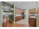 Open-concept kitchen featuring wooden cabinetry, granite countertops and stainless steel appliances at 112 Pink Dogwood Ln, Mebane, NC 27302