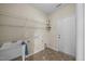 Laundry room with shelving, utility sink and tile floors at 112 Pink Dogwood Ln, Mebane, NC 27302