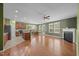 Spacious living room with a fireplace, seamlessly connecting to the kitchen and dining area at 112 Pink Dogwood Ln, Mebane, NC 27302