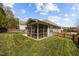 View of an enclosed porch, wood fence, and green backyard, offering a private outdoor space at 112 Pink Dogwood Ln, Mebane, NC 27302