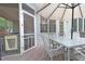 Enjoy the back deck with screened-in door access to the outside, and outdoor furniture at 1120 Scholastic Cir, Durham, NC 27713