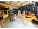 Unfinished basement with visible joists, pipes and vapor barrier at 1120 Scholastic Cir, Durham, NC 27713