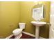 Cozy powder room featuring a pedestal sink and unique wall color at 1120 Scholastic Cir, Durham, NC 27713