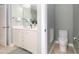 Stylish bathroom featuring a vanity with storage and an adjacent toilet area for added convenience at 1120 Scholastic Cir, Durham, NC 27713