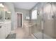 Bright bathroom features a glass-enclosed shower and separate soaking tub for a spa-like experience at 1120 Scholastic Cir, Durham, NC 27713