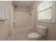 Bright bathroom features a shower and tub combo with a window for natural light at 1120 Scholastic Cir, Durham, NC 27713