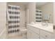 Bathroom featuring a shower and tub, sink with vanity, and a large mirror at 1120 Scholastic Cir, Durham, NC 27713