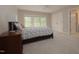 Comfortable bedroom features a large window and carpeted floor at 1120 Scholastic Cir, Durham, NC 27713