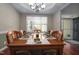 Formal dining room with hardwood floors and elegant chandelier at 1120 Scholastic Cir, Durham, NC 27713