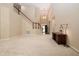 Cozy living room featuring a media cabinet, and a staircase leading to the second floor at 1120 Scholastic Cir, Durham, NC 27713