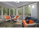 Cozy screened-in porch with comfortable seating and views of the surrounding greenery at 1120 Scholastic Cir, Durham, NC 27713
