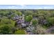 An aerial view showcases this home's location surrounded by lush greenery and a friendly neighborhood at 116 W Front St, Oxford, NC 27565
