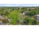 Breathtaking aerial shot of a historic neighborhood, surrounded by mature trees and blue skies at 116 W Front St, Oxford, NC 27565