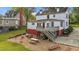 This home features an outdoor deck, play area, seating, picnic table, and a well-manicured lawn at 116 W Front St, Oxford, NC 27565
