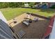 Inviting backyard with a cozy fire pit area, tiki torches, and lush green lawn for outdoor enjoyment at 116 W Front St, Oxford, NC 27565