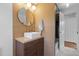 Modern bathroom featuring a sleek vanity with unique wood facade and contemporary fixtures at 116 W Front St, Oxford, NC 27565